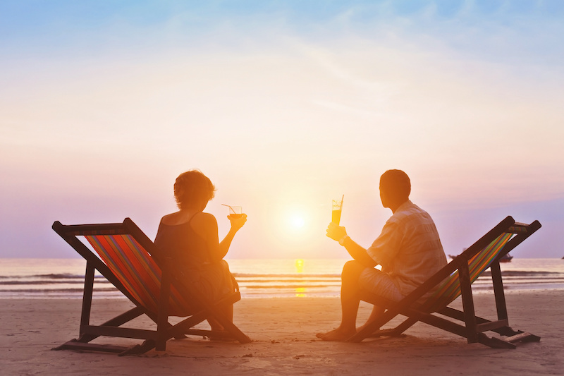 couple enjoying retirement on beach, goals based financial planning